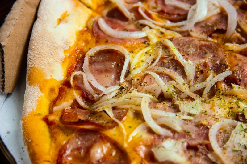 pizzaluce BBQ Chicken pizza with smoky sauce and caramelized onions